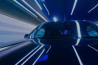 A car bearing the Benewake logo surrounded by blue light trails