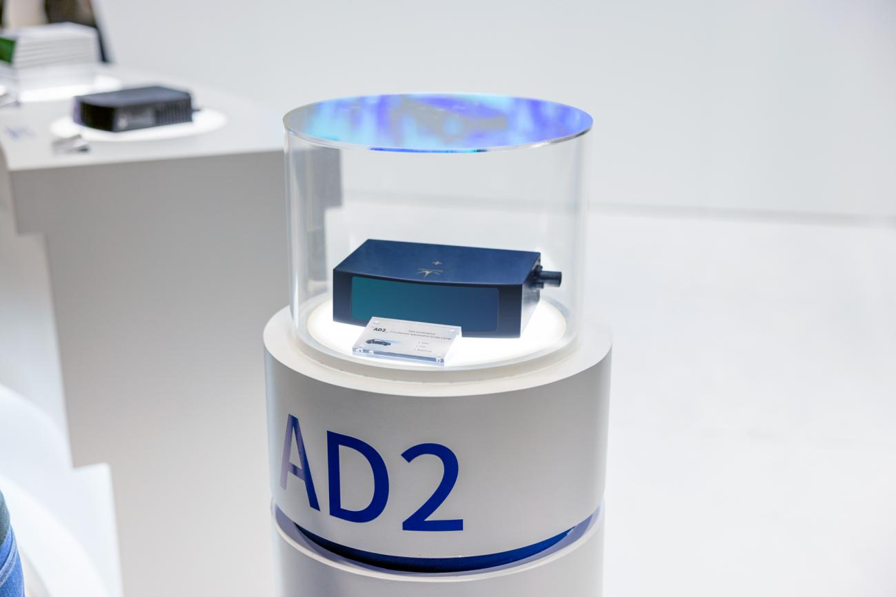 AD2 automotive-grade LiDAR displayed in a transparent case at CES 2023